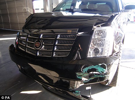 Opening shot: Woods's badly damaged SUV vehicle after the accident which led to revelations of his marital infidelities