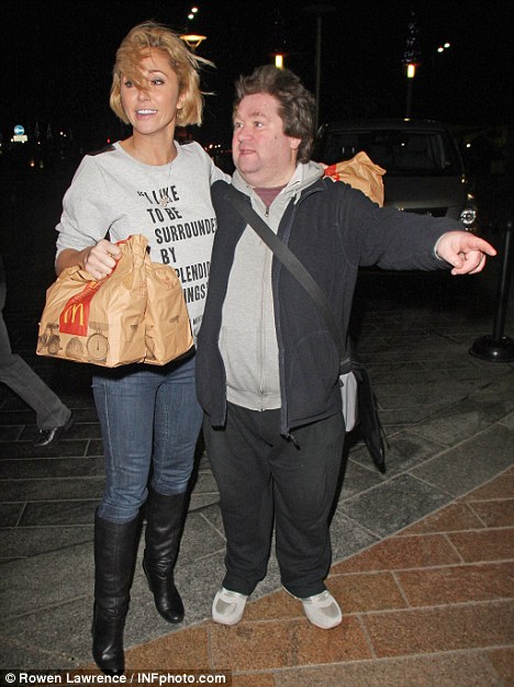 KFC's that way: Jenny is stopped by a fan outside her hotel