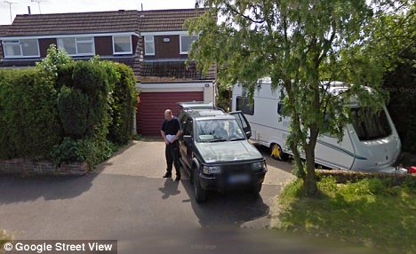 A man and his 4x4 parked next to the caravan outside the Soanes' home