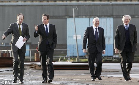 David Cameron and Lord Heseltine with Peel Holdings bosses at the Wirral Waters development on Merseyside today