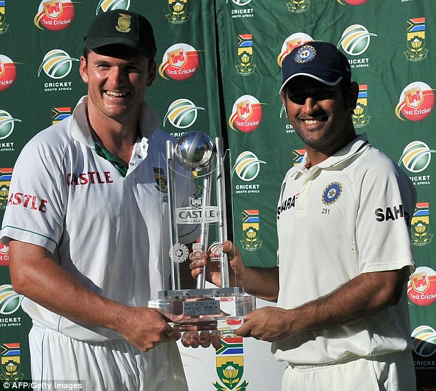 Sharing the spoils: Graeme Smith and Mahendra Singh Dhoni both had their hands on the trophy after a draw in the final Test