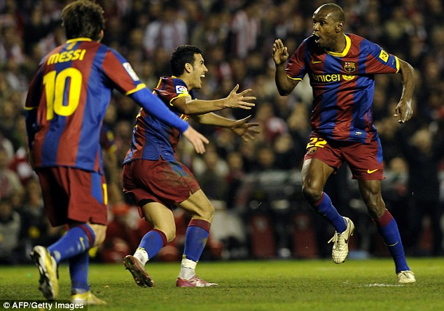 Up for the cup: Eric Abidal (R) goes wild as he celebrates a rare goal with Barcelona team-mates in the 1-1 draw with Athletic Bilbao in the Copa del Rey