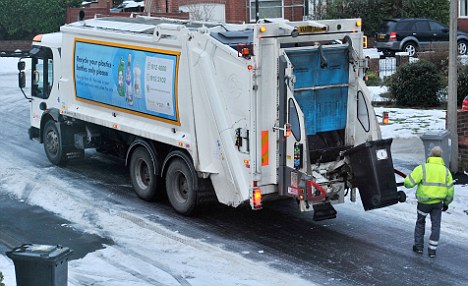 Take a bow: Countless councils across the country have continued to collect rubbish despite the adverse weather (file picture)