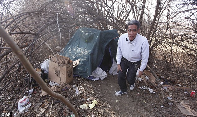 New start: Mr Williams reveals the tent where he has been sleeping rough on the north side of Columbus, Ohio