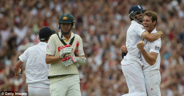 Alastair Cook jumps on Chris Tremlett after he took the final wicket of Michael Beer