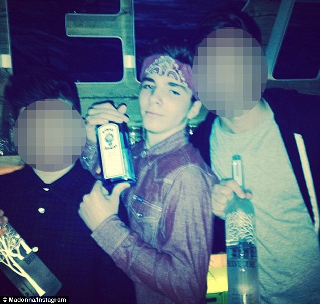 'Bring it! 2014!' Madonna shared an Instagram snap Saturday of her 13-year-old son Rocco Ritchie clutching a bottle of 94-proof Bombay Sapphire gin