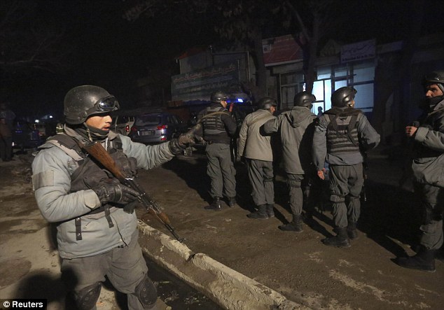 Police: Armed officers surround the scene after the bombing. The Taliban claimed responsibility for the attack an hour later