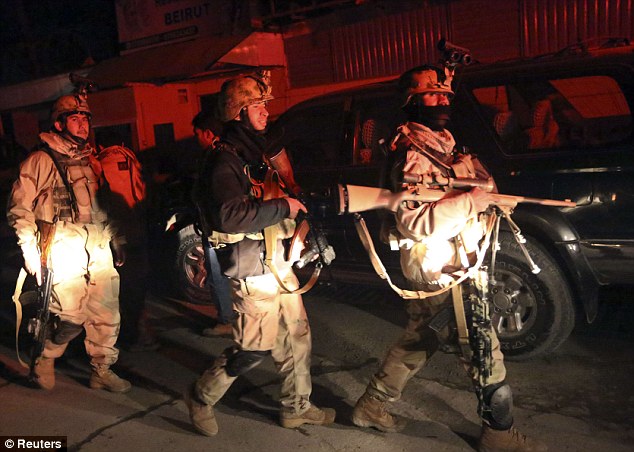 Patrol: Heavily armed soldiers with night-vision goggles attached to their helmets surrounded the restaurant after the nighttime blast