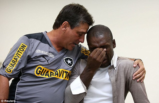 Emotional: Seedorf sheds a few tears during a farewell gathering with Botafogo players on Tuesday