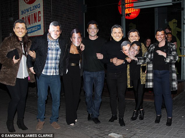 Behind the mask: Mark's pals make a dig at his celebrity status with party masks of him