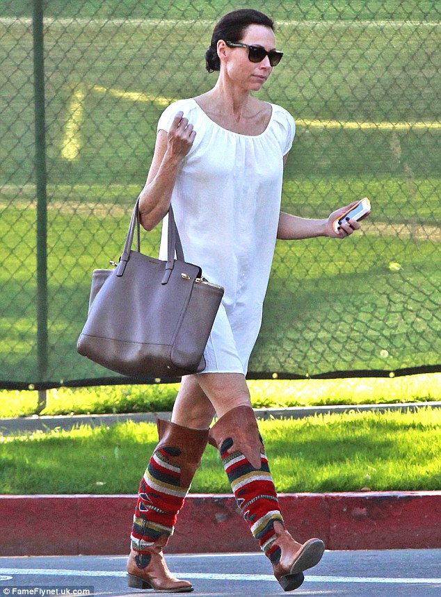 Eye catching: Minnie Driver steps out in a pair of Navaho style statement boots in Beverly Hills on Friday