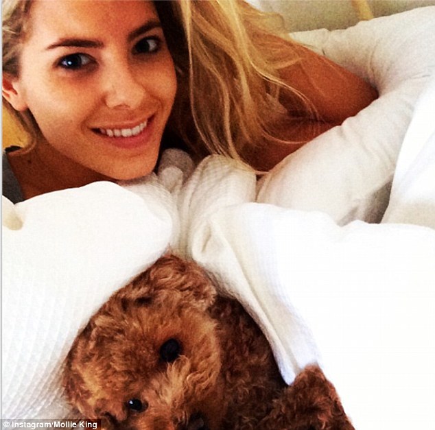 In bed with...: Mollie gets cosy with her favourite teddy bear for the selfie snap