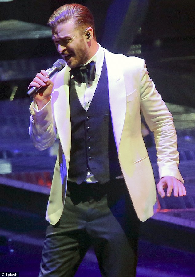 Spiffy: The Sexy Back singer wore a slick snow white jacket over a dark vest and white button up shirt with a black satin bow-tie