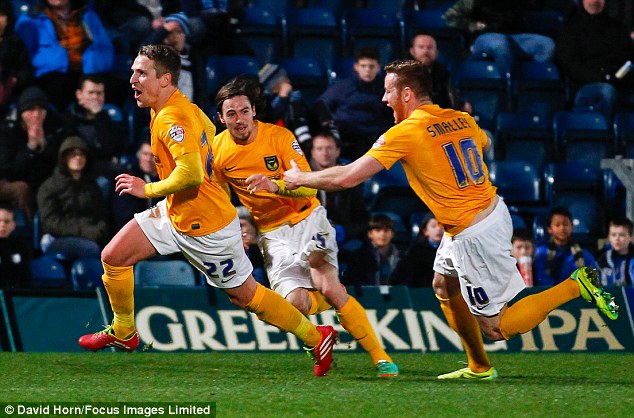 Scholar scores: Oxford's Nicky Wroe celebrates his winner at Wycombe in a spirited match