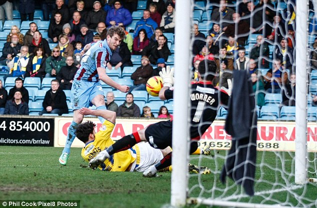 Clean sheet: Scunthorpe's Sam Winnall's shot is saved by AFC Wimbledon's Ross Worner as his side's kept goalless