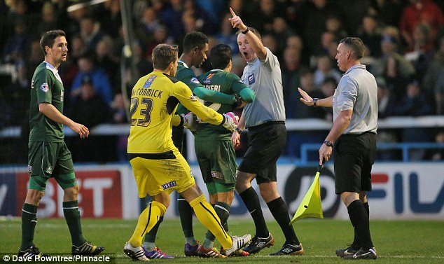 Seeing red: Plymouth's Andres Gurrieri is sent off for striking defender Rochdale defender Jack O'Connell