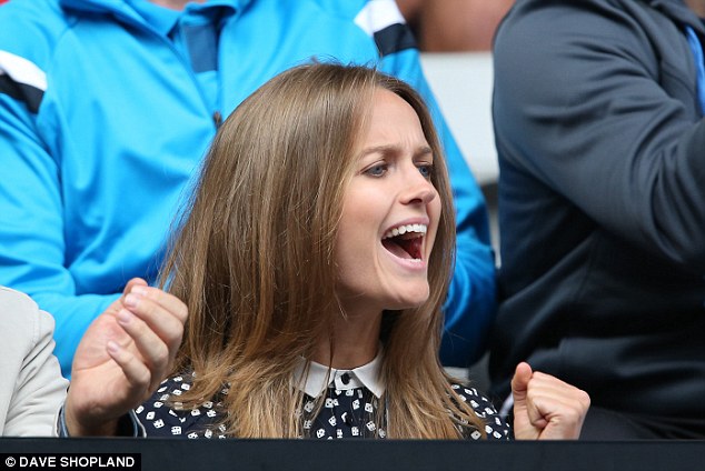 All smiles: Kim Sears roars her approval as Murray races through past Lopez