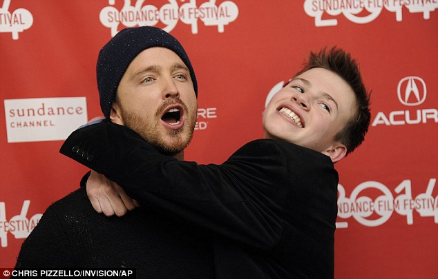 Paling around: Aaron got chummy with co-star Josh Wiggins at the premiere for Hellion