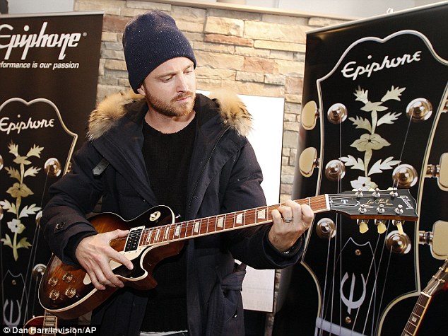 Guitar hero: The 34-year-old showed off his musical skills on an Epiphone