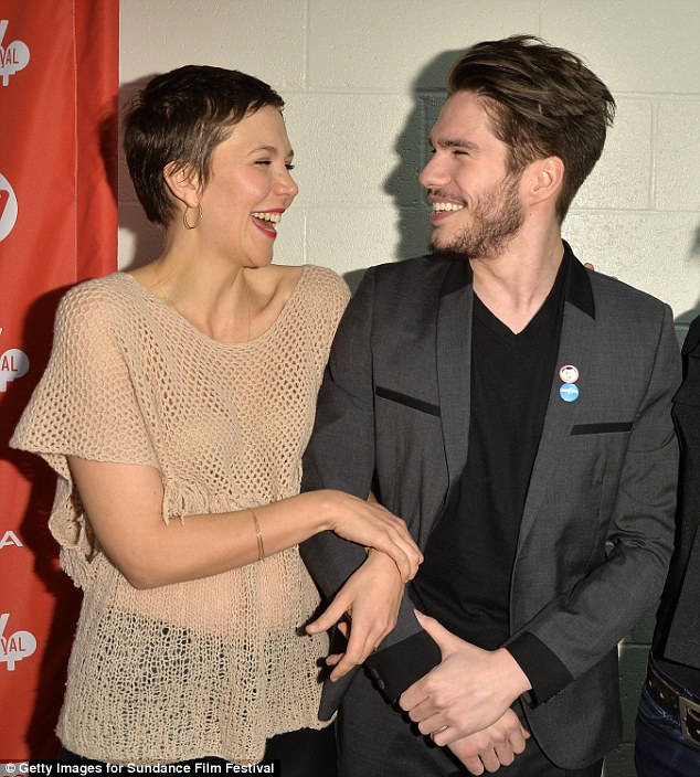 Beauty: Maggie looked adorable with her pixie cut as she giggled with Scoot McNairy during the event