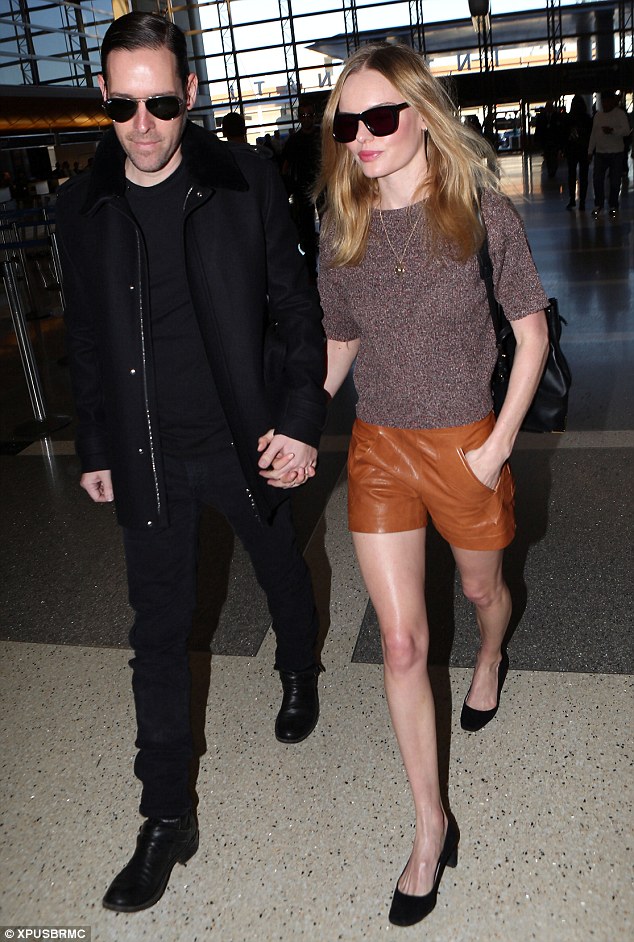 Leggy look: Kate Bosworth showed off her pins in leather shorts as she walked through a terminal at LAX with her husband Michael Polish on Friday