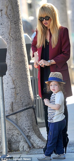 Run, Skyler, run! The 42-year-old stylist donned a long raspberry blazer and suede thigh-high boots for their mother-son outing