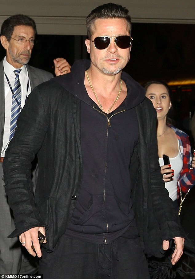 Fly boy: Brad Pitt was spotted at the Los Angeles airport on Friday with a new haircut