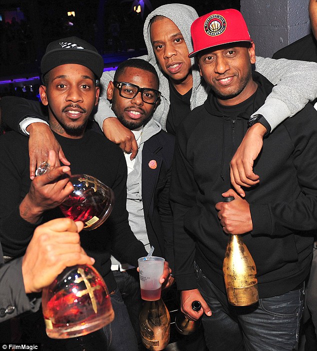 His entourage: Jay Z partied with his pals: Ruggs, Von Smith and Alex Gidewon on Thursday