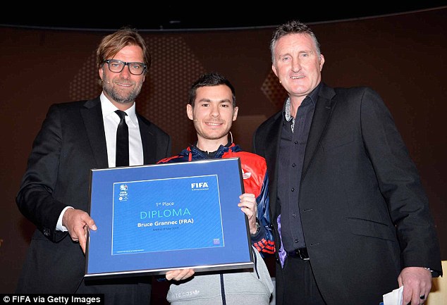 Well done: Grannec is congratulated by Klopp (left) and Alan McInally (right), who gives in-game score updates on FIFA 14