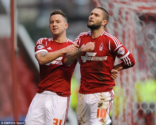 Play-off hopefuls: Lansbury (right) celebrates opening the scoring with Simon Cox (left)