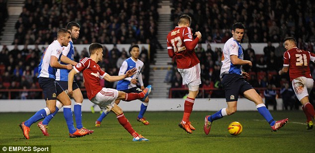 Game over: Jamie Paterson lashes the ball beyond Blackburn keeper Simon Eastwood to put his side 3-1 up