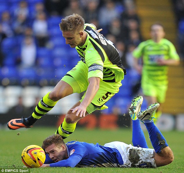 Flat out: Birmingham City's Brian Howard is fouled by Yeovil Town's Byron Webster