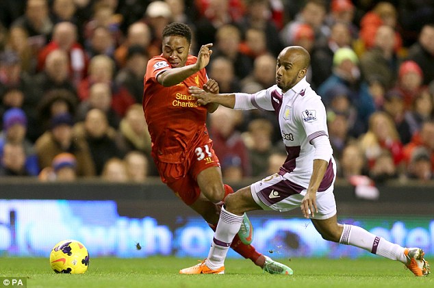 Clipped: Raheem Sterling is tripped by Villa midfielder Fabian Delph