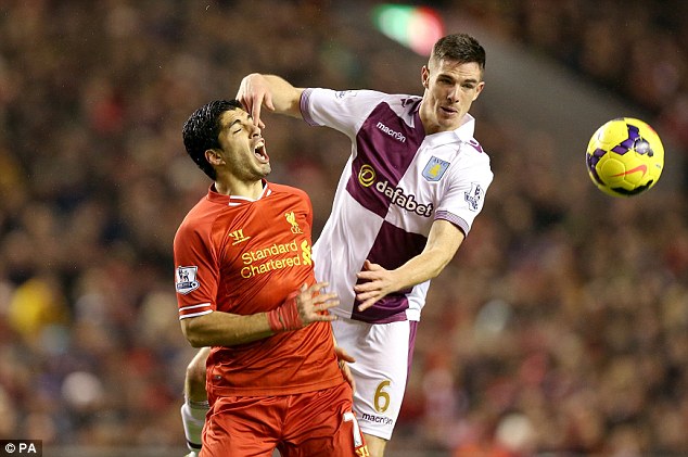 In the eye: Suarez reacts to a finger in the face from Ciaran Clark