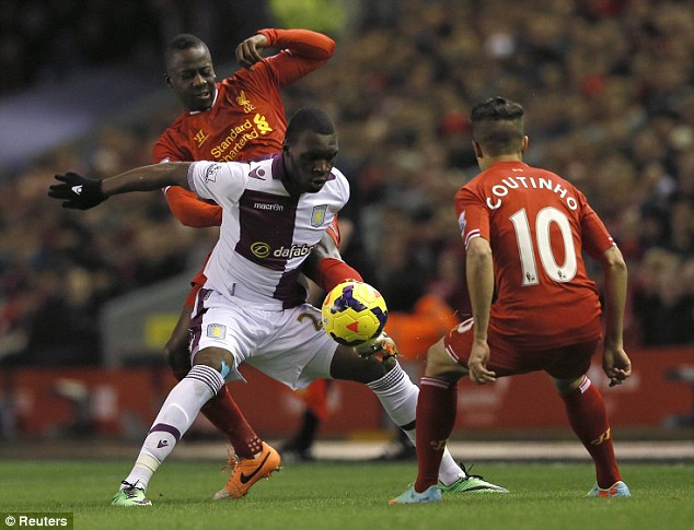 Shield: Benteke keeps the ball from Aly Cissokho and Philippe Coutinho