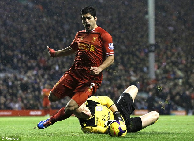 Falling down: Luis Suarez goes down to win a penalty for Liverpool, who were trailing 2-0