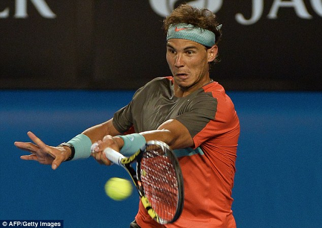 Rock solid: Nadal plays a shot during a clinical performance on the same day that rivals Andy Murray and Roger Federer also advanced into the fourth round