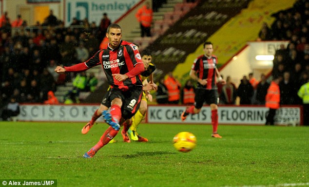 Level: Bournemouth's Lewis Grabban scores from the penalty spot to earn his side a point against Watford