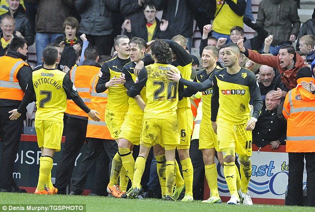 Hero to zero: Gabriele Angella is congratulated on his goal the Watford man was later sent off