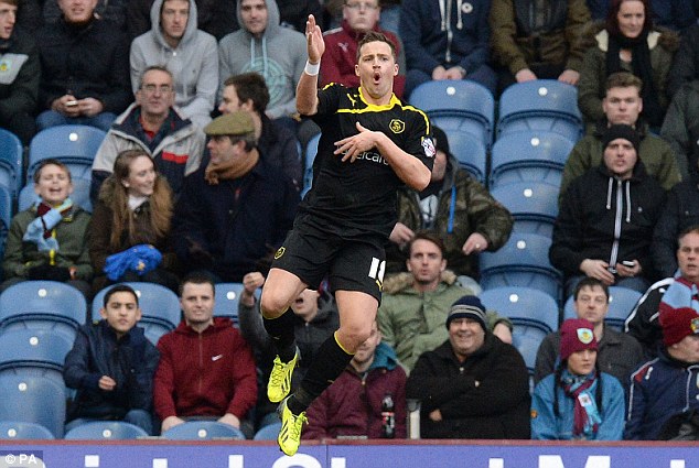 Flying high: Sheffield Wednesday striker Chris Maguire jumps for joy after equalising for Stuart Gray's side