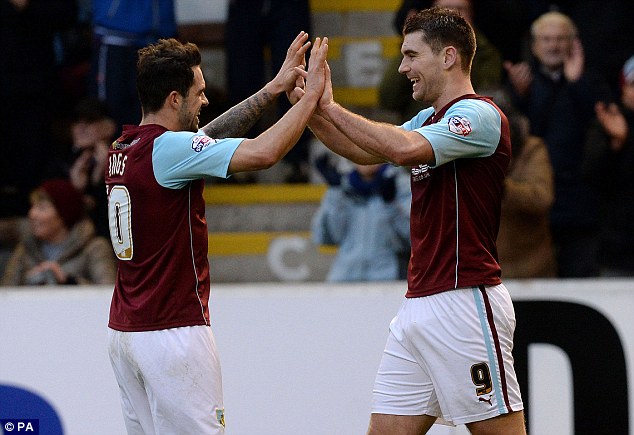 Double act: Fellow frontman Danny Ings congratulates Vokes following the striker's opener