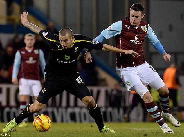 Battle: Wednesday's Joe Mattock holds off the challenge of Burnely wideman Keith Treacy