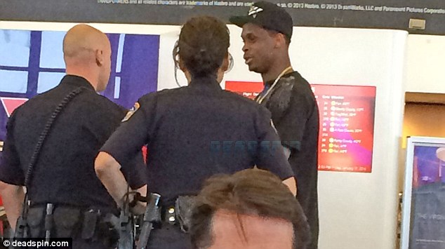 Police involvement: Smith was pictured speaking to police at the airport but no arrest was made