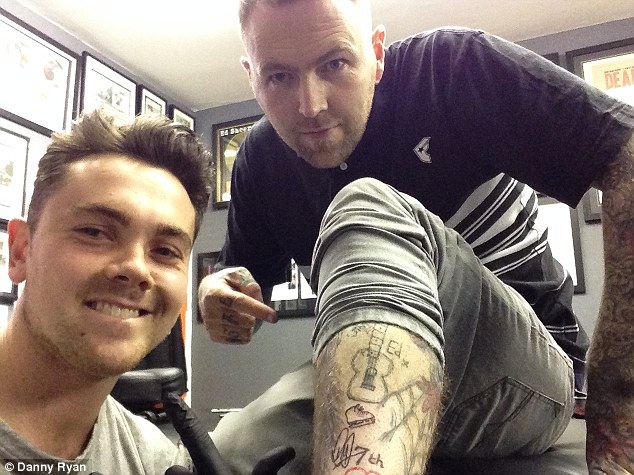 The boy done good: Ray shows off his handwork on the leg of celebrity tattoo artist Kevin Paul, who is based in Derby