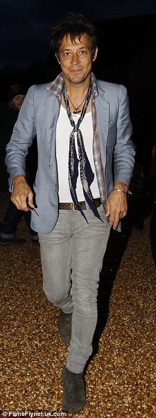 Too cool: Jamie Hince made sure to dress in his effortlessly cool style, with a pale blue blazer, wife-beater, neck scarf and grey skinny jeans