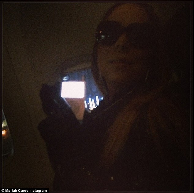 Flying in style: Mariah posted a snap to her Instagram and Twitter accounts of herself on the plane, with the caption - 'Spent the flight sequencing my album, pretty standard'