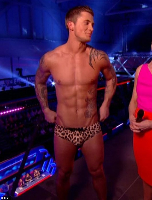 Hunky star: Dan Osbourne dived off the board wearing leopard print trunks on Saturday night