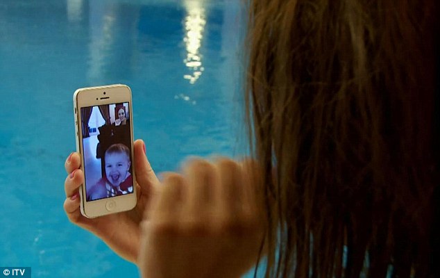 She's a family woman: The model and mother-of-three was seen FaceTiming her kids from the side of the pool