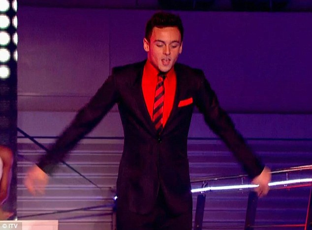 It suits you: Tom Daley dived into the pool during a professional performance wearing a full suit, shirt and tie