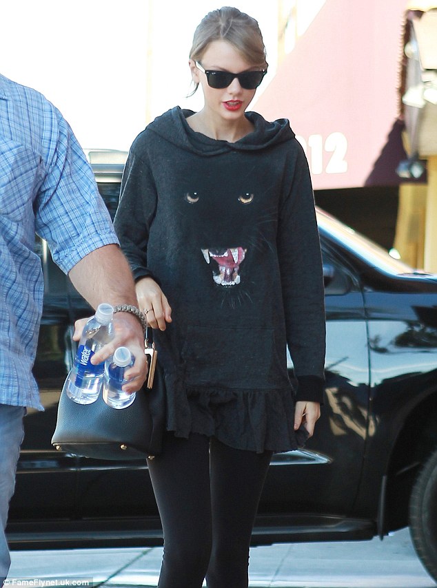 Staying hydrated: Taylor had someone carry some bottled water for her to keep her fluids up